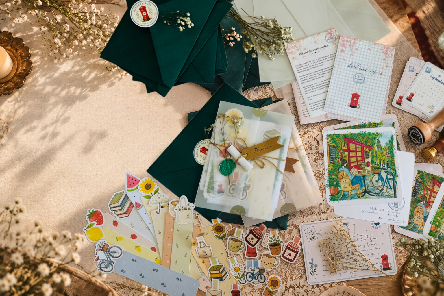 A Hiraeth Post arrangement with an envelope, letters, artwork, calendar and puzzle